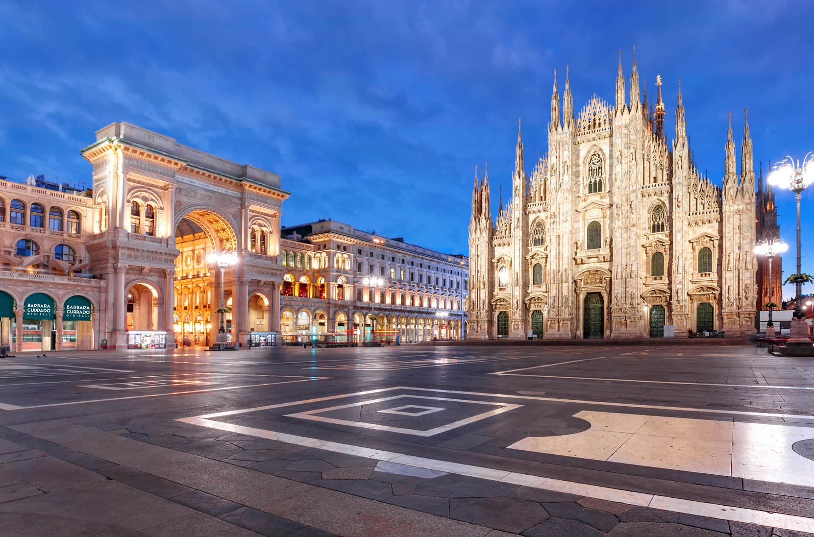 Panorama of the Piazza del Duomo, Cathedral Square, with Milan Cathedral or Duomo di Milano and Galleria Vittorio Emanuele II, during morning blue hour, Milan, Lombardia, Italy